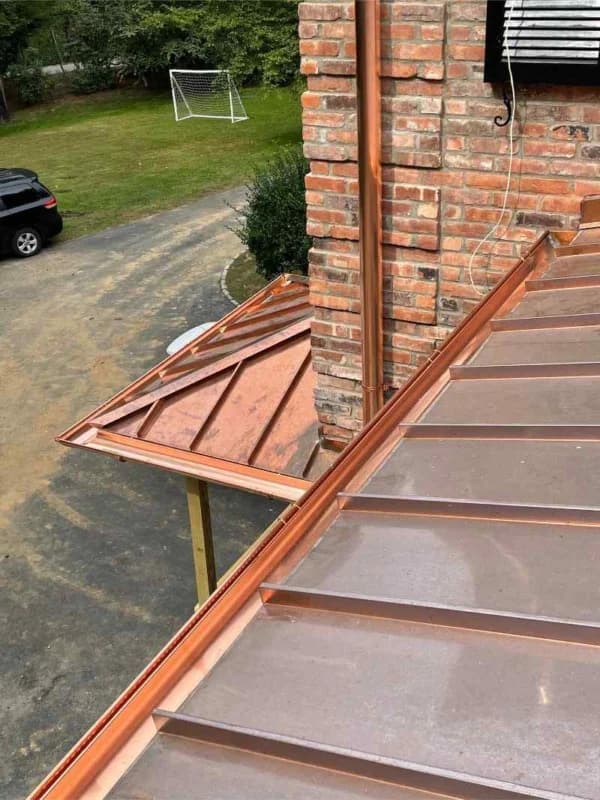 Copper metal roof and gutter installation