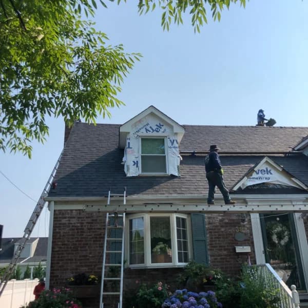 Dark shingles installed on a steep roof